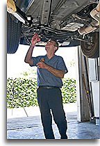 Haik inspecting car