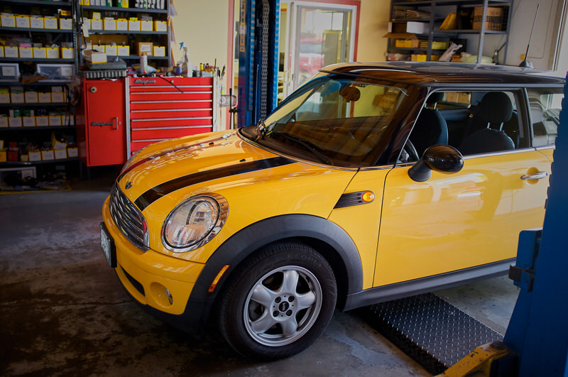Yellow Mini Cooper for service at Haik's German Autohaus
