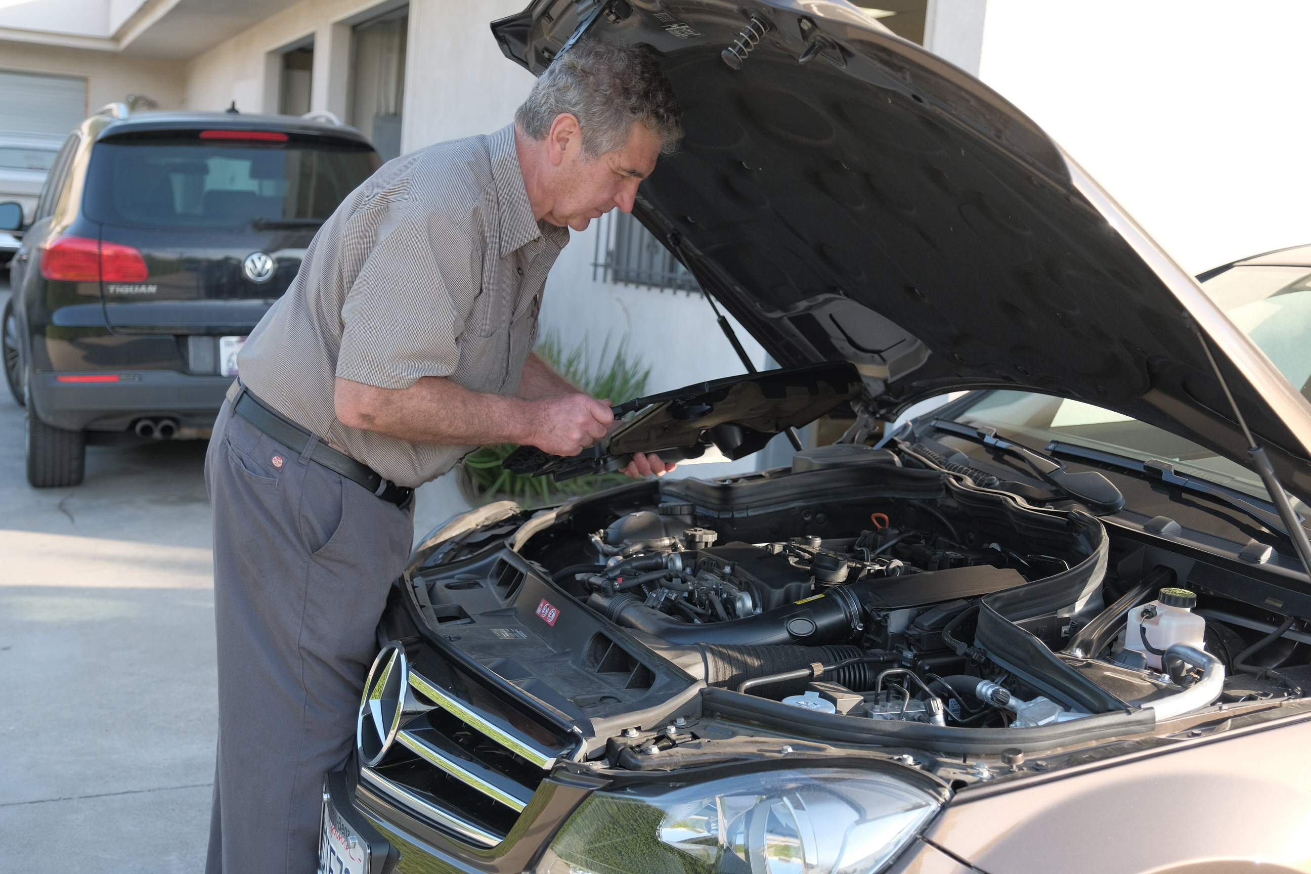 Haik inspecting Merdeces engine in Santa Barbara at Haik's German Autohaus